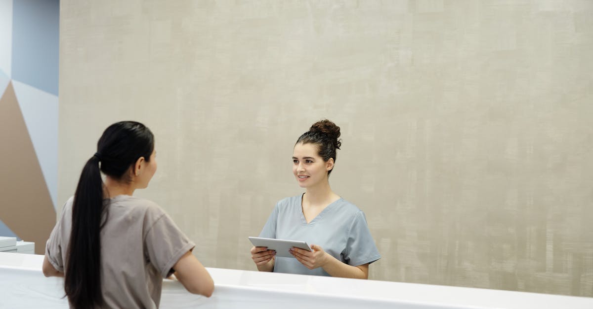 Streamlined clinic reception desk with a parent scheduling a follow-up, showing efficient patient management.