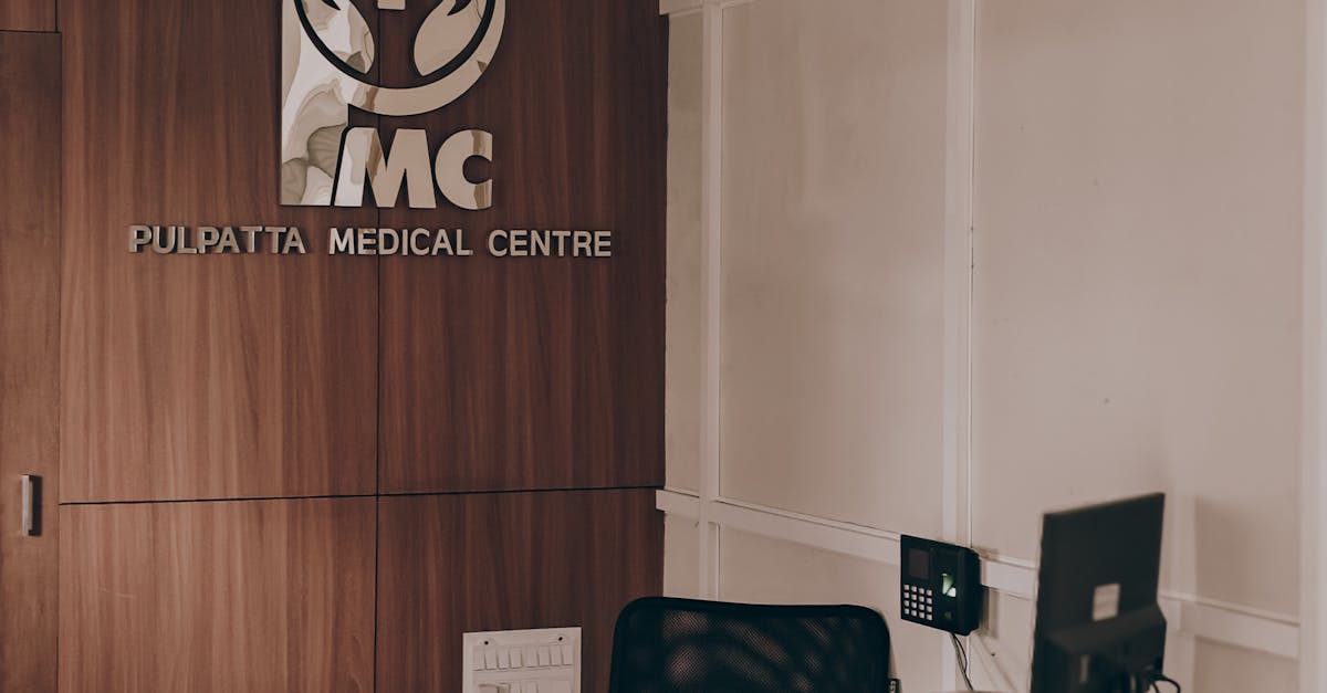 Healthcare professional efficiently managing patient appointments on a computer in a bright clinic reception.