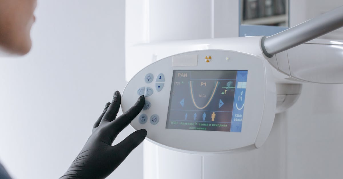 Doctor reviewing patient electronic health records on a tablet in a modern clinic office.